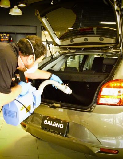 Applying product to rear boot hatch area and sanitising