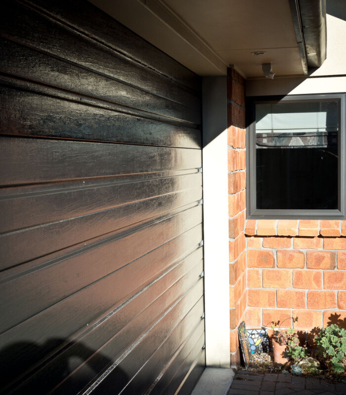 Side view if the garage door cleaned and ready for coating