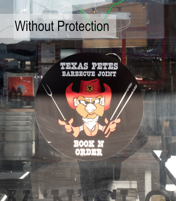 Showing a black vinyl sign without UV protection