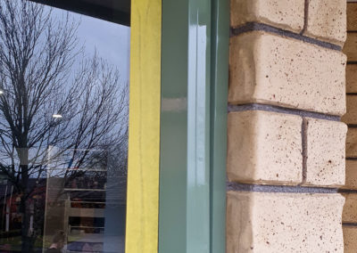 Window frame with high-gloss restoration on it.