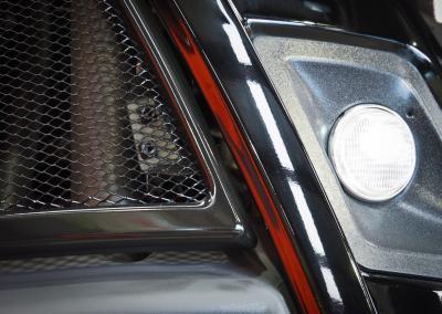 Close up of left rear grill and light section with coating applied