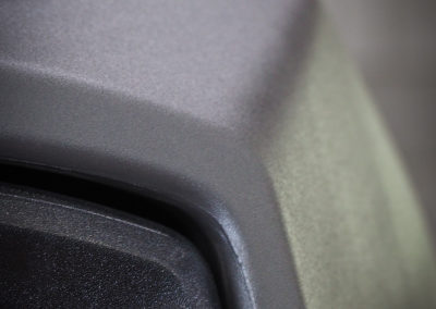 Close up of light housing and plastics after coating applied