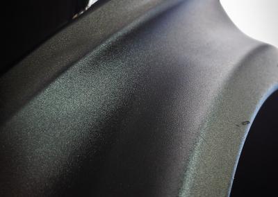 Coated plastic protected from UV damage